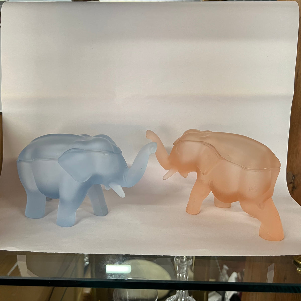 Made by Indiana Glass for Tiara, this glass elephant lidded trinket box is as unique as it is functional. Perfect for everything from buttons to jewelry to candy and more. Dates to the 1980s.