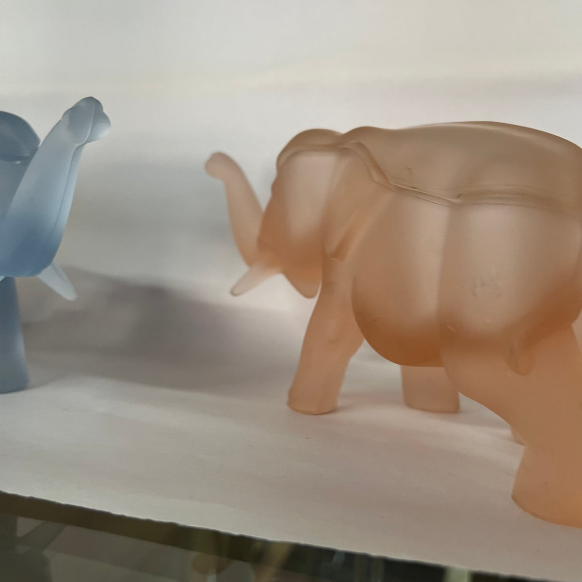 Made by Indiana Glass for Tiara, this glass elephant lidded trinket box is as unique as it is functional. Perfect for everything from buttons to jewelry to candy and more. Dates to the 1980s.