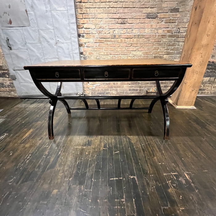 Black lacquer desk that has a smooth rattan inlay on top.  Three drawers.  Chicago, IL Studio Sonja Milan