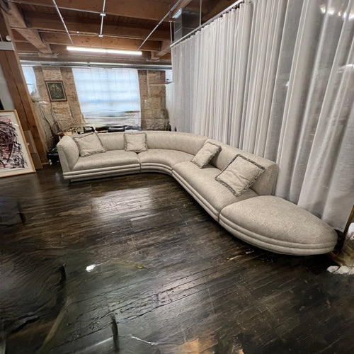 Mid-century curved sectional sofa attributed to Vladimir Kagan for Weiman Furniture. upholstered in a stunning neutral faux snakeskin fabric.